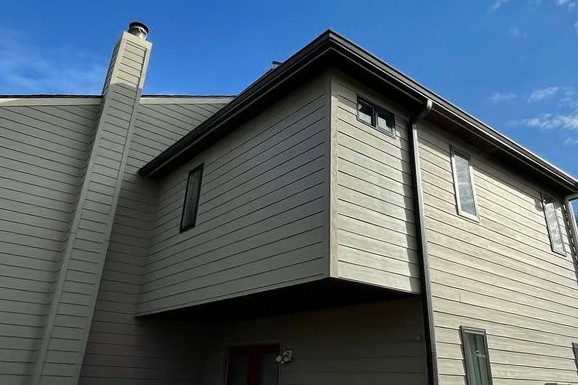 Bryn Mawr second-story addition after: finished lap siding, gutters and windows