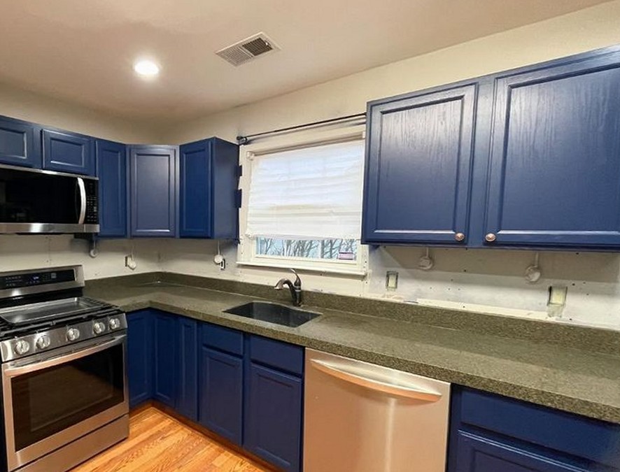 Navy refinished kitchen cabinets