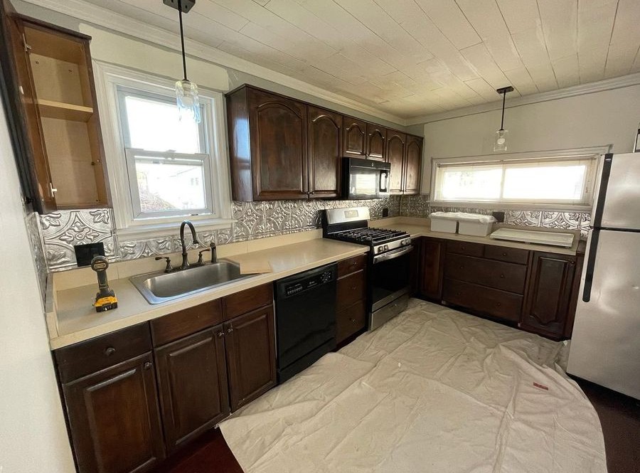 Kitchen before: dark cabinets