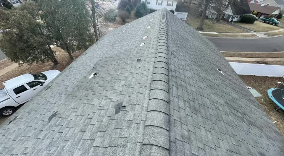 Finished architectural shingle roof, new ridge cap