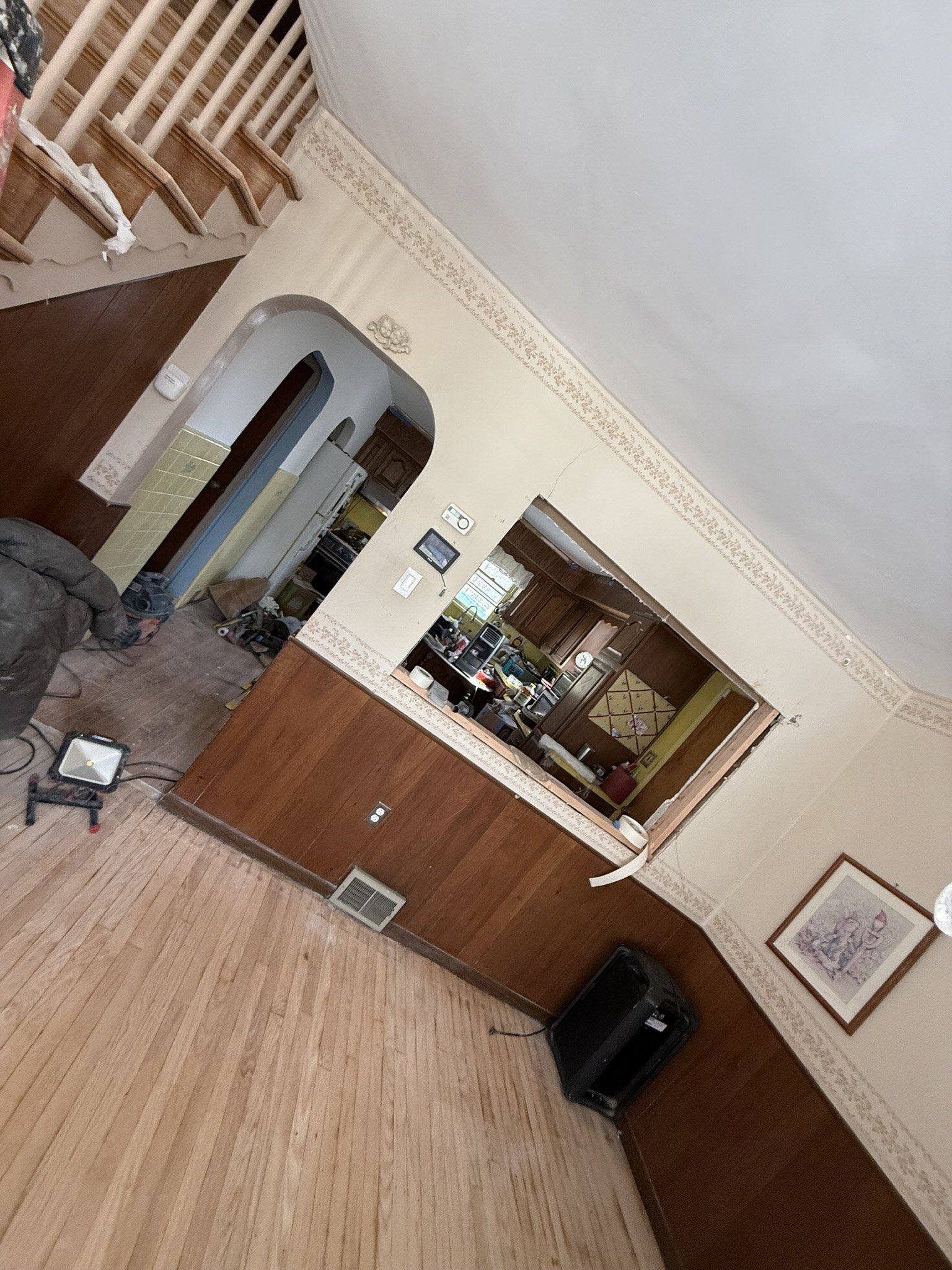 Before: dining room mid-project, floors stripped for refinishing