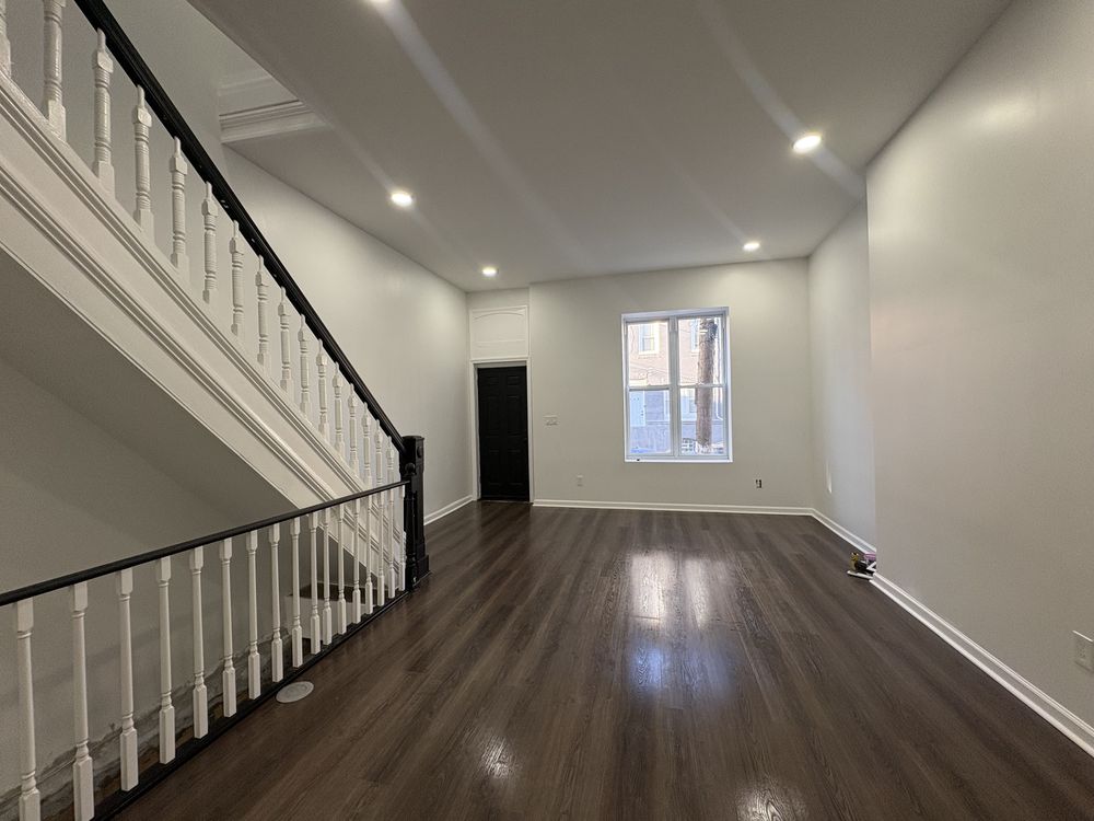 Stage 4: finished interior with new floors and stair rail